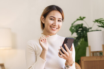Attractive asian young woman using smartphone working office desk in office workplace.