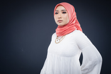 Portrait of a beautiful female Muslim model wearing hijab, a lifestyle apparel for Muslim women isolated. Modern hijab fashion concept.