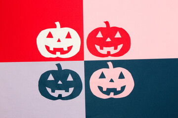 colorful background divided into 4 parts with colorful carved pumpkins, creative halloween concept,...