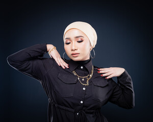 Portrait of a beautiful female Muslim model wearing hijab, a lifestyle apparel for Muslim women isolated. Modern hijab fashion concept.