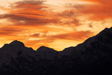 Sunset on the peaks of the Andes Mountains, Views from the San Carlos de Bariloche Circuit, Nahuel Huapi National Park. Patagonia, Argentina.