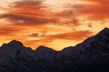 Fototapeta premium Sunset on the peaks of the Andes Mountains, Views from the San Carlos de Bariloche Circuit, Nahuel Huapi National Park. Patagonia, Argentina.