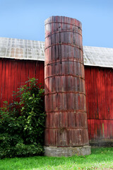 Red Wooden Silo Besides Barn