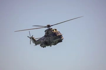 Fotobehang Flying military helicopter © bizoo_n