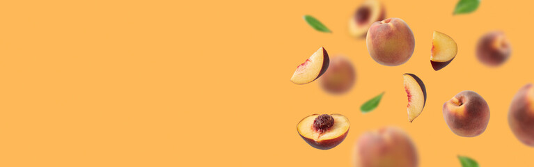 Flying fresh ripe juicy peaches isolated on an orange  background. Сoncept of food levitation