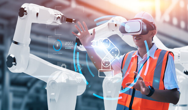 Engineer using virtual reality machine operating AI robot mechanical hand artificial intelligence technology, graphical user remote screen, interacting tablet device control working factory banner