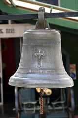 Fototapeta premium Bell Ringing for the fallen comrades who have died during the war time, Beautiful solid bell with twined rope to ring it.
