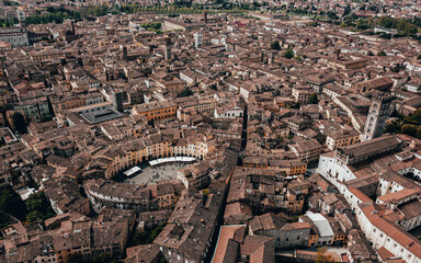Landmarks of Italy - Piazza dell'Anfiteatro - The Famous Amphitheater Square in Lucca city.  Panoramic View. Aerial view landscape. View from above. Drone Image - obrazy, fototapety, plakaty