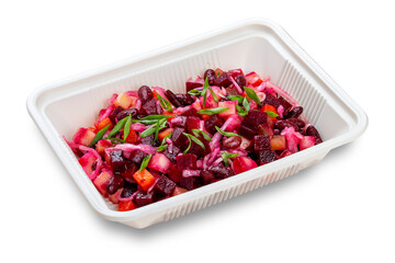 Vinegret or vinaigrette Russian red salad with cooked and pickled vegetables, peas, beetroot. In a plastic container. Food to go. On a light background.