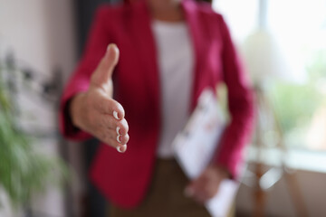 Closeup of woman hand reaching out for greeting in office