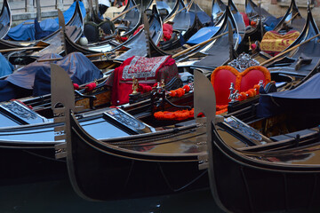 Fototapeta na wymiar Gondolas in lagoon of Venice on sunrise, Italy