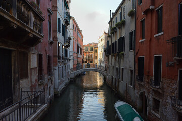 Fototapeta na wymiar Scenic canal with gondola, Venice, Italy, in summer