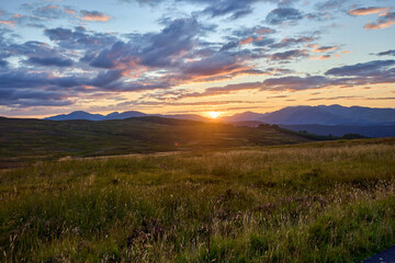 A stunning sunset over the glens and hills of Scotland
