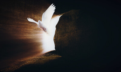 White dove and tomb symbolizing the crucifixion and resurrection of Jesus Christ for Easter
