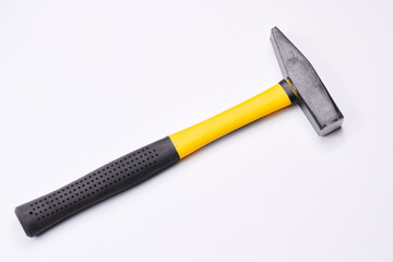 Yellow construction hammer isolated on white background closeup