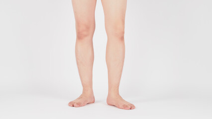 Asian Male legs and barefoot is standing on white background.