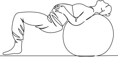 pregnant woman doing gymnastics on a big ball