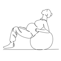 pregnant woman goes in for sports on a big ball gymnastics childbirth