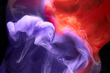 Blue red colorful smoke abstract background, acrylic paint underwater explosion