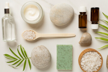 Composition with spa products on marble background, top view