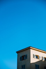 colourful buildings fro, the south of France with a blue sky in the background