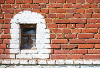 Fototapeta na wymiar Windows on an old brick house.