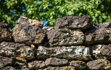 Wall of stone bricks on the fence.