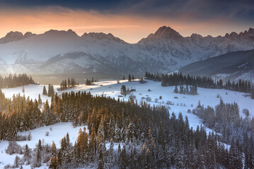 Tatra Mountains, winter, snow, frost. Panorama of the winter Tatra Mountains and peaks at sunrise,...