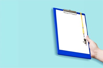 Testing System concept. Hands hold a paper on clipboard.