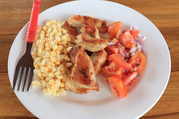 breakfast corn with meat and tomatoes