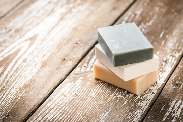 Natural soap bars on wooden background