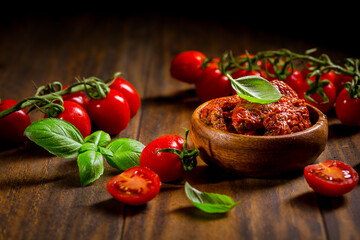 Sun dried and pickled tomatoes with fresh herbs and spices