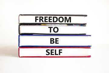 Freedom to be self symbol. Concept words Freedom to be self on books on a beautiful white table white background. Business, psychological freedom to be self concept.