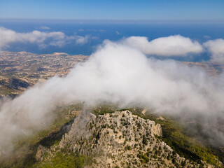 Beautiful natural landscape, aerial view of Cyprus mountains and blue sky with clouds, Mediterranean sea. Buffavento Castle. Nature background.