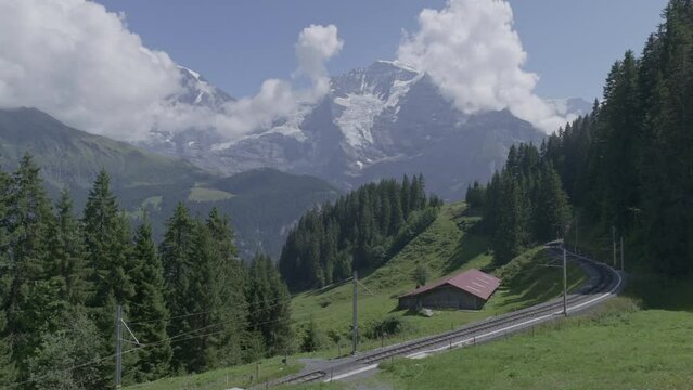 View of the railroad tracks on the route to the Murren Jungfrau Region, Swiss Alps Berner Oberland.  Panasonic S1 Vlog (29.97fps, Apple ProRes422HQ)