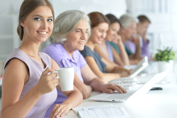 Portrait of a beautiful business girl and business team 