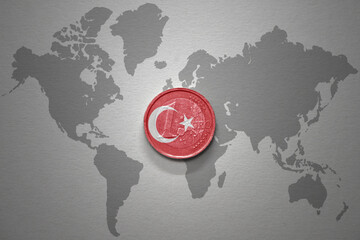 euro coin with national flag of turkey on the gray world map background.3d illustration.