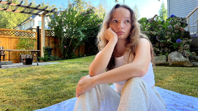 Portrait of beautiful fashion cute tenage body positivity natural model dressed in summer hipster vintage white stylish clothes and swimming suit . Trendy girl posing sitting. positive woman. 