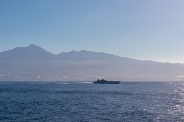 Scenic view on passenger ferry driving on sea connection between port of San Sebastian de La Gomera and Los Cristianos, La Gomera, Tenerife, Canary Islands, Spain, Europe. Island hopping vacation