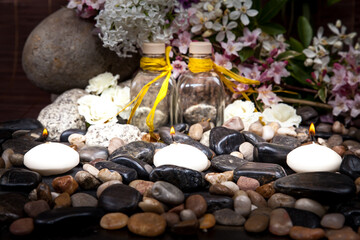Aromatherapy, spa, beauty treatment and wellness background with massage stone, flowers, burning candles... spa concept