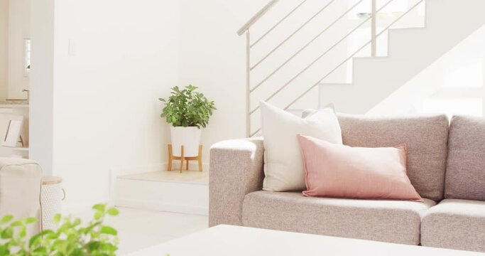 General view of living room interior with sofa and stairs