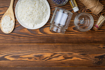 Handmade candles.Soy candle making set.Soy wax, fragrance and essential oil, wick,dried lavender flowers and glass candle holder.DIY.Hobby.place for text. Place to copy.