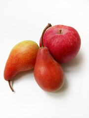 red pears and apple on white background
