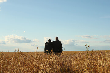 Young adult son and father in the wheat field on a blue sky background. Pavel Kubarkov, i and my Father Alexander. Photo was taken 3 September 2022 year, MSK time in Russia. - 531753715