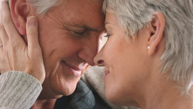 Love, trust and support of senior couple smile and touch head for affection and happy at home. Married elderly man and woman being close and sharing romantic moment while feeling secure