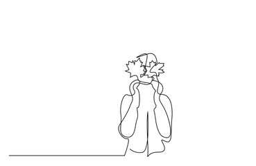 one person holds fallen autumn leaves in her hand to close her eyes autumn concept single line