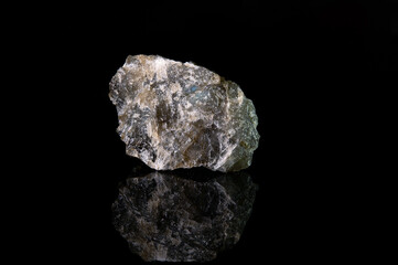 A fragment of the mineral labradorite with a rough crystalline surface