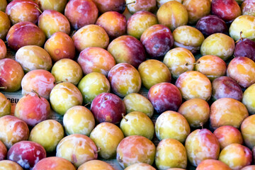 Texture from plum fruits, fresh harvest on the market
