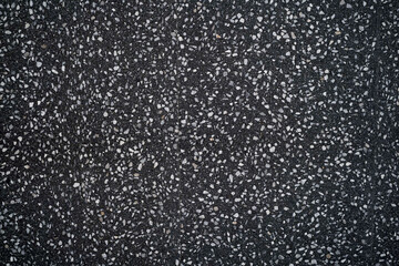 black terrazzo floor. Dark polished marble stone floor.  Black chips of polished stone floor tile...