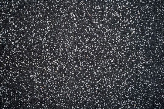 black terrazzo floor. Dark polished marble stone floor.  Black chips of polished stone floor tile and wall tile design and ceramic